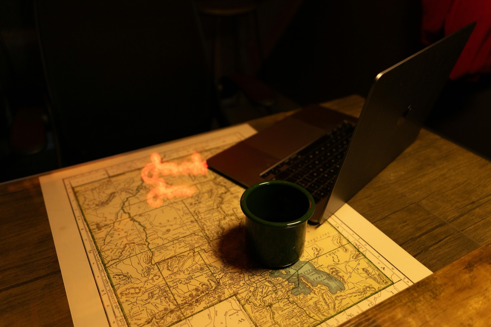 A laptop and paper map laid out for local SEO planning